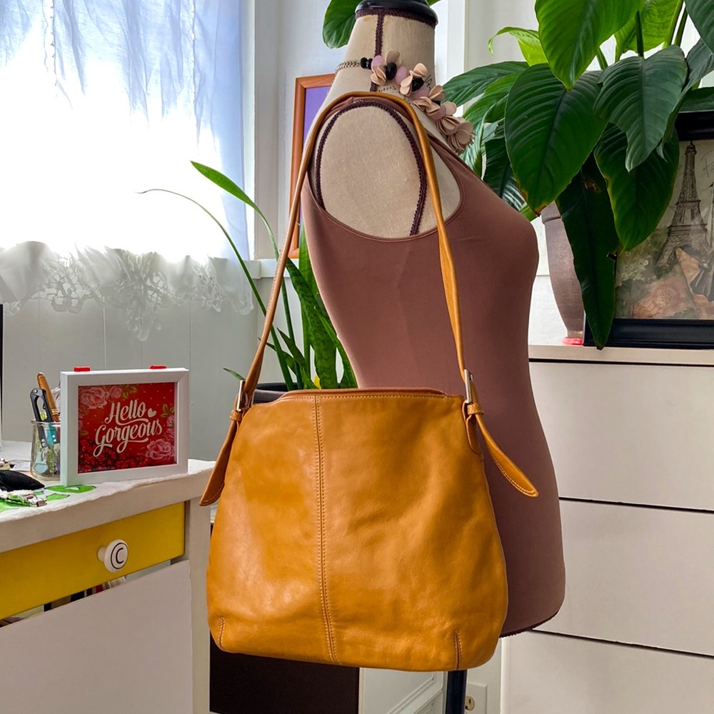 Tignanello genuine leather purse with many compartments.